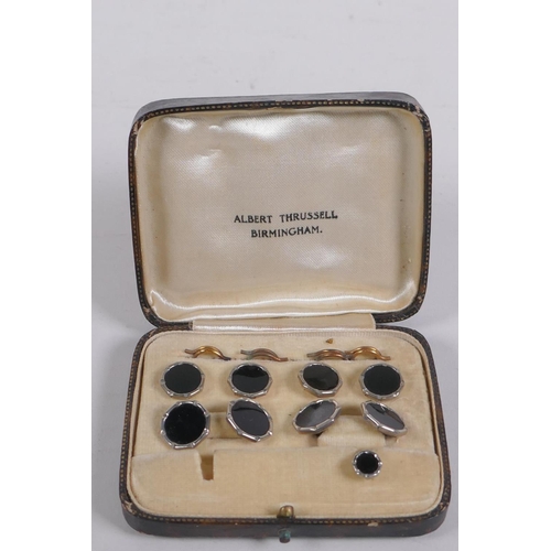 639 - A cased set of black enamel and white metal cufflinks and studs, 1 stud missing