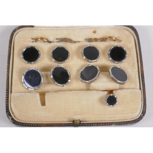 639 - A cased set of black enamel and white metal cufflinks and studs, 1 stud missing