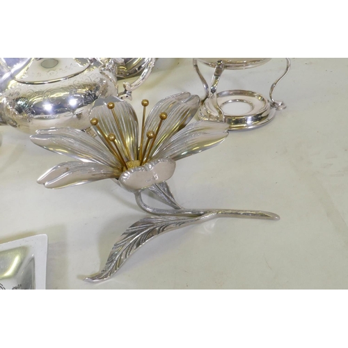 643 - A good quantity of silver plated wares, a shaped tray, four piece tea set, centrepiece etc, tray 27c... 