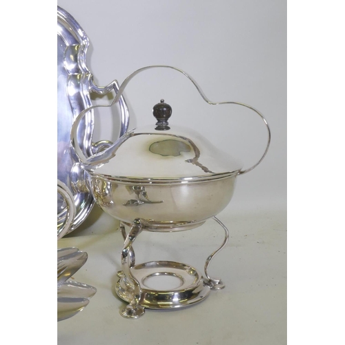 643 - A good quantity of silver plated wares, a shaped tray, four piece tea set, centrepiece etc, tray 27c... 