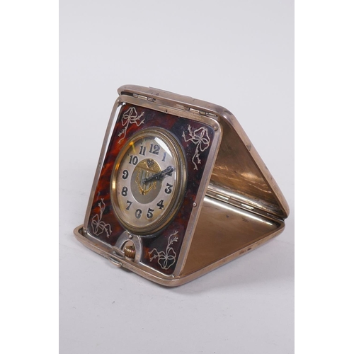 648 - An Edwardian silver cased travelling clock, the dial with enamelled Arabic numbers and gilt decorati... 