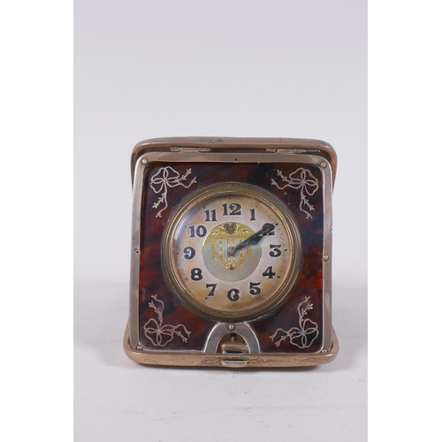 648 - An Edwardian silver cased travelling clock, the dial with enamelled Arabic numbers and gilt decorati... 