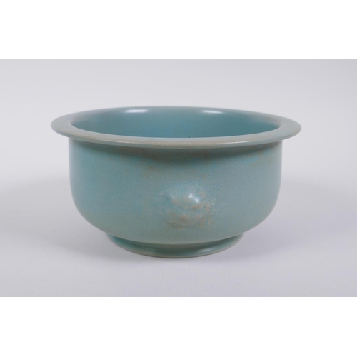 65 - A Chinese ru ware style porcelain steep sided bowl with twin mask handles, 18cm diameter