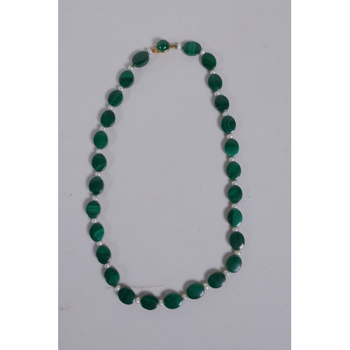 653 - A malachite bead and seed pearl necklace with a 9ct gold clasp, 33cm long