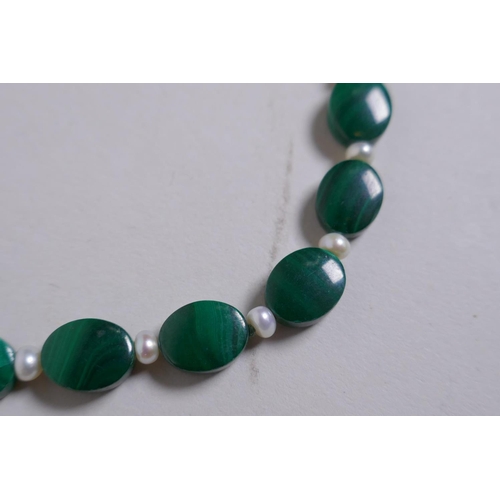 653 - A malachite bead and seed pearl necklace with a 9ct gold clasp, 33cm long