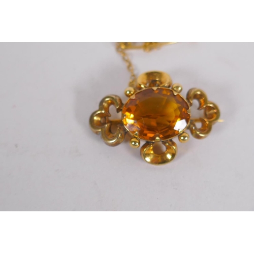 657 - A Victorian yellow metal pendant brooch, set with a citrine, 3cm long, 3.8g