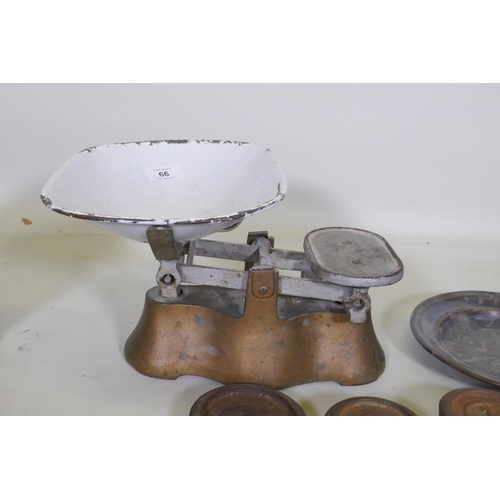 66 - A set of antique weighing scales and weights, a pair of pewter plates with heraldic designs, a C19th... 