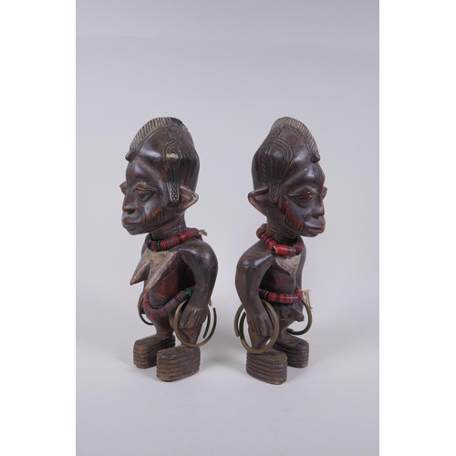 69 - A pair of African Yoruba tribe carved wood Ere Ibeji figures, 28cm high