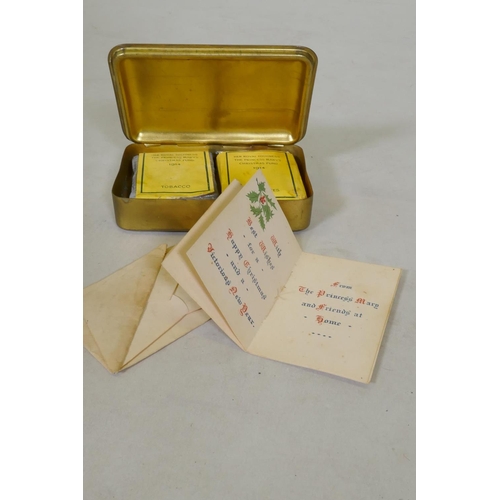 7 - A WWI Christmas 1914 Princess Mary gift tin, with cigarettes and unopened tobacco, and greetings car... 