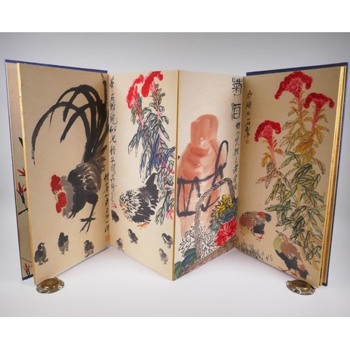 73 - A Chinese printed concertina watercolour book depicting insects, birds, flowers and fruit, 30 x 59cm