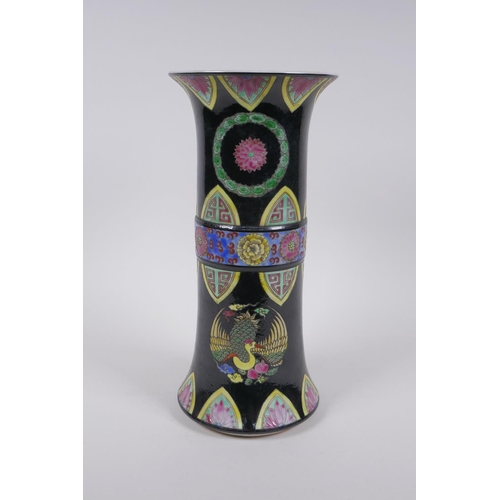75 - A Chinese famille noir porcelain gu shaped vase with phoenix and lotus flower decoration, YongZheng ... 
