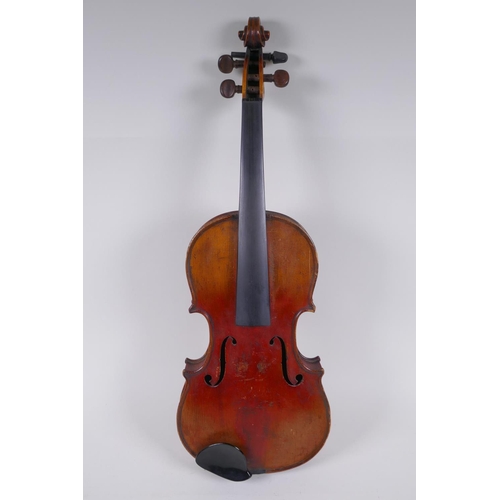 79 - A C19th violin and associated equipment, in a wood case, 59cm long