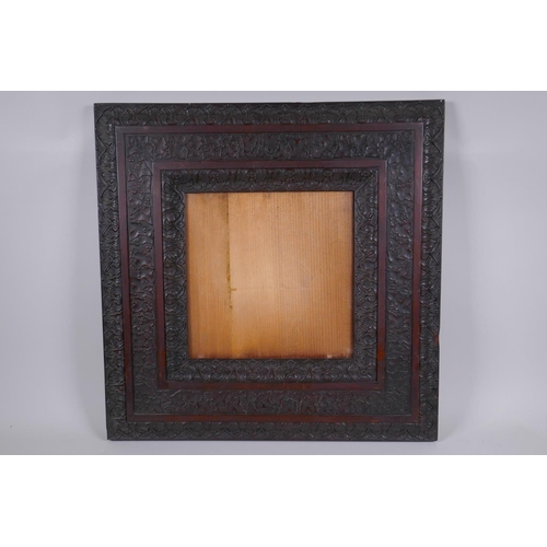 820 - A C19th elaborately carved mahogany frame, 25 x 25cm