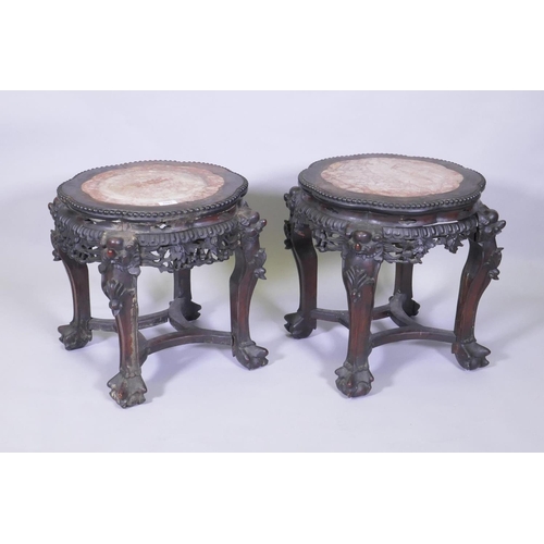 1001 - A pair of C19th Chinese hardwood tables/stands, with inset rouge marble tops, carved and pierced fri... 