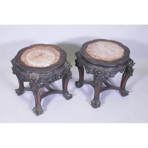 1001 - A pair of C19th Chinese hardwood tables/stands, with inset rouge marble tops, carved and pierced fri... 