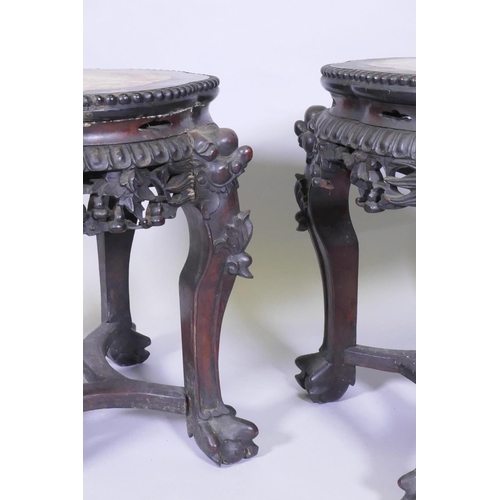 1001 - A pair of C19th Chinese hardwood tables/stands, with inset rouge marble tops, carved and pierced fri... 