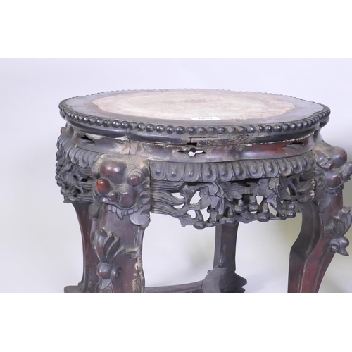 1001 - A pair of C19th Chinese hardwood tables/stands, with inset rouge marble tops, carved and pierced fri... 