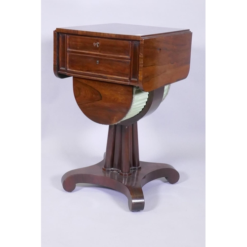 1005 - A C19th rosewood work table with drop leaf top over two drawers, the upper fitted with a pull out pe... 