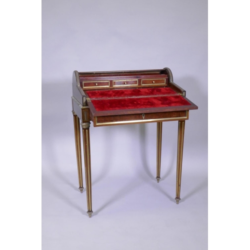 1012 - A French mahogany bonne heure du jour, with brass mounts, the pull out drawer operating the tambour ... 