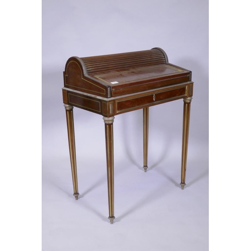 1012 - A French mahogany bonne heure du jour, with brass mounts, the pull out drawer operating the tambour ... 