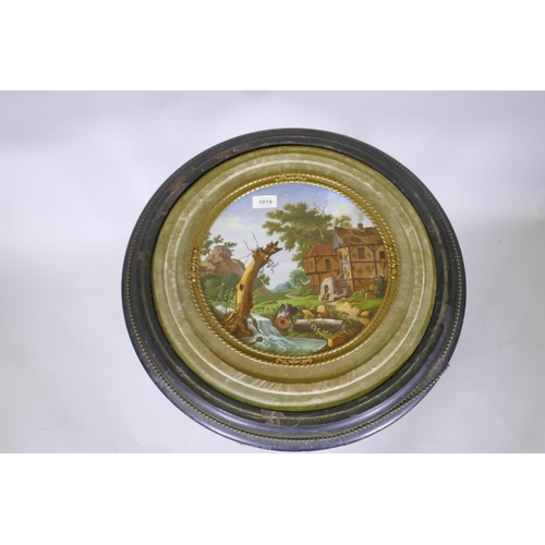 1019 - A C19th continental table, the top with inset porcelain panel hand painted with rural landscape, rai... 