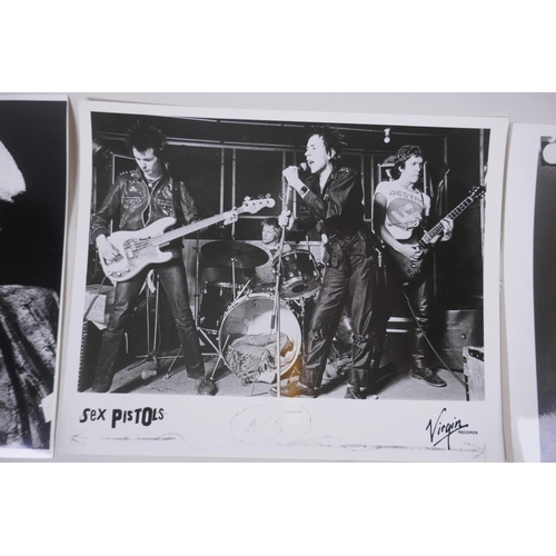 102 - A collection of black and white press photographs of punk bands/musicians including Hugh Cornwell, S... 