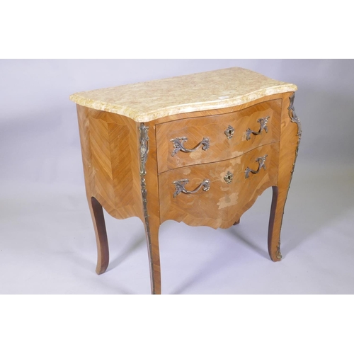 1020 - A continental inlaid tulipwood commode with marble top, drawers and serpentine front, raised on shap... 