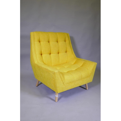 1027 - A contemporary buttoned fabric easy chair