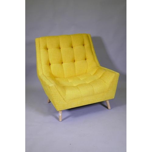 1027 - A contemporary buttoned fabric easy chair