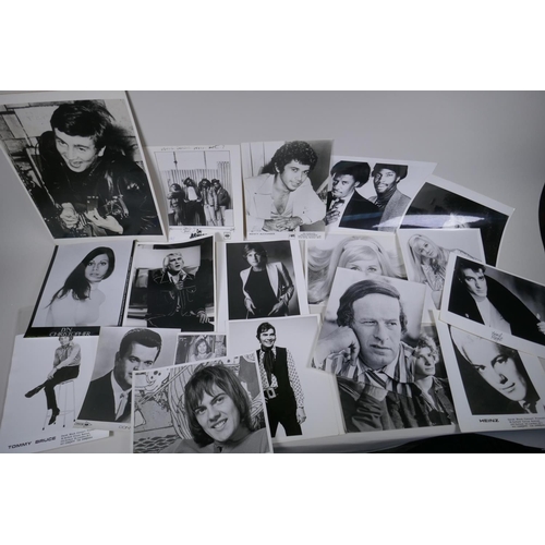 103 - A quantity of black and white press and promotional photographs of musicians, including Elvis, Madne... 