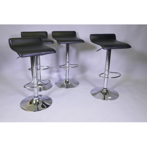 1032 - A set of four contemporary chromed metal and leatherette adjustable bar stools