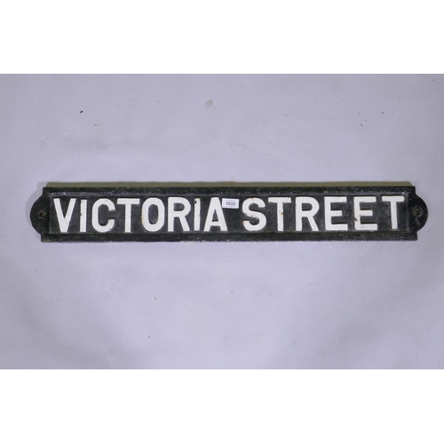 1033 - An antique cast iron street sign, Victoria Street, 90cm long