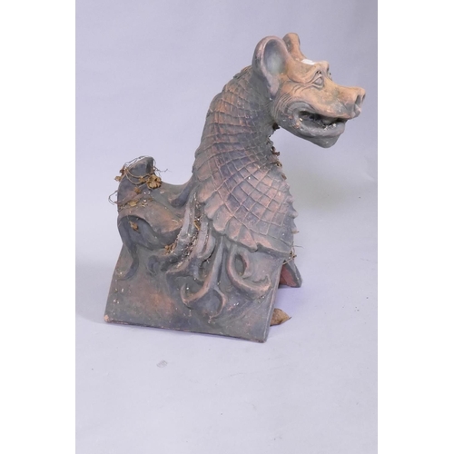 1037 - A terracotta ridge tile in the form of a gargoyle, 48cm high