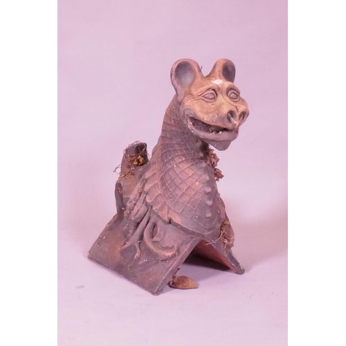 1037 - A terracotta ridge tile in the form of a gargoyle, 48cm high