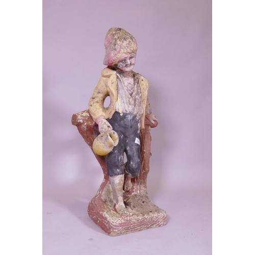 1038 - A painted concrete garden figure of a young boy leaning on a tree stump, 80cm high