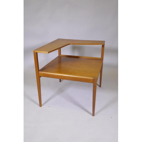 1046 - A mid century teak two tier occasional table in the manner of Peter Hvidt, 66 x 61 x 63cm high