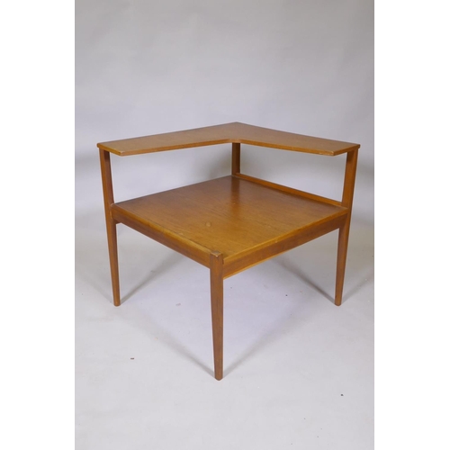 1046 - A mid century teak two tier occasional table in the manner of Peter Hvidt, 66 x 61 x 63cm high