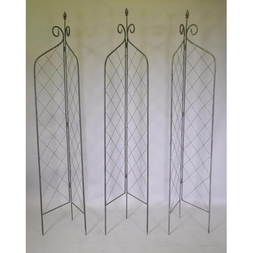 1055 - Three folding wrought iron garden trellises, 212cm high