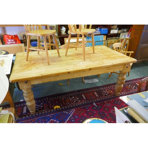 1064 - A pine farmhouse table, adapted from a pool table base, and four kitchen chairs, 102 x 200cm