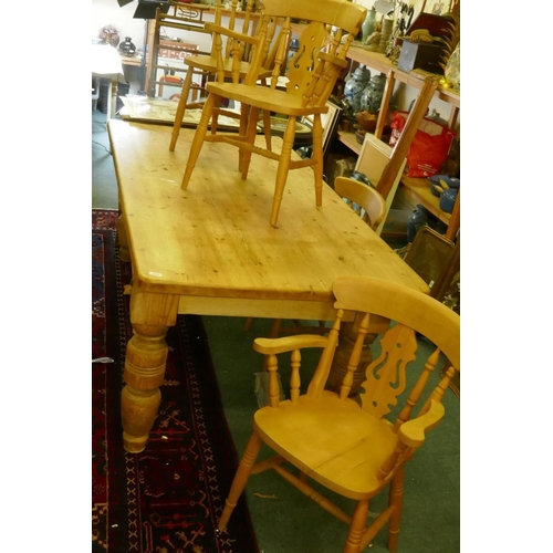 1064 - A pine farmhouse table, adapted from a pool table base, and four kitchen chairs, 102 x 200cm