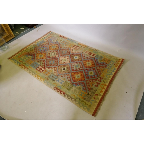 1067 - An Afghan multicolour ground wool kilim, with geometric design, 126 x 186cm