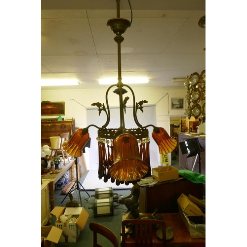 1068 - An early C19th continental pendant ceiling light with three branches and amber glass drops and shade... 