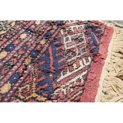 1071 - A Turkish terracotta ground wool rug with all over geometric design, 98 x 154cm