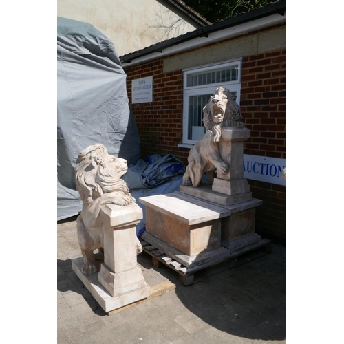 1073 - A pair of carved marble figures of lions mounted on plinths, 166cm high