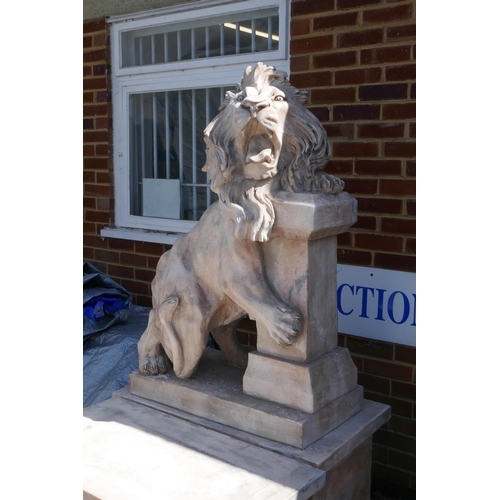 1073 - A pair of carved marble figures of lions mounted on plinths, 166cm high