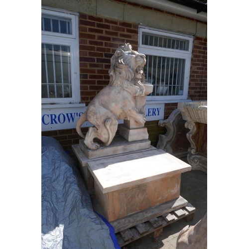 1073 - A pair of carved marble figures of lions mounted on plinths, 166cm high