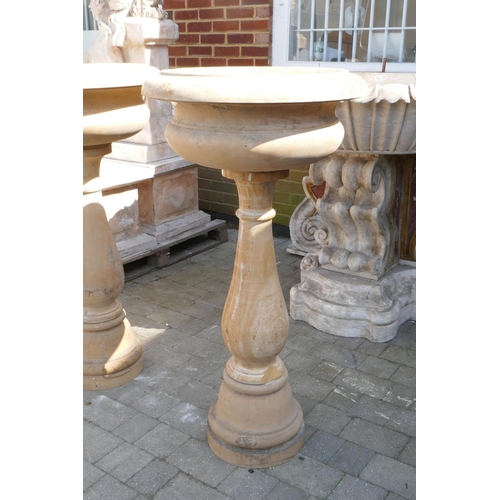 1080 - A pair of stone cast urns on stands, 60cm diameter, 118cm high