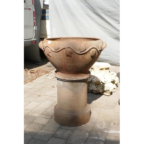 1082 - A terracotta urn on stand, 60cm diameter, 79cm high