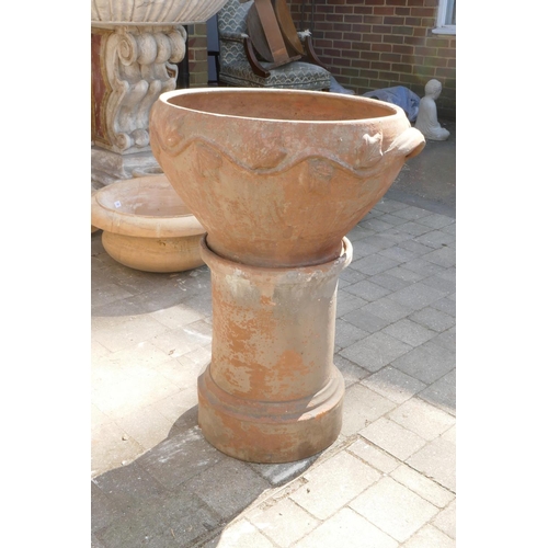 1082 - A terracotta urn on stand, 60cm diameter, 79cm high