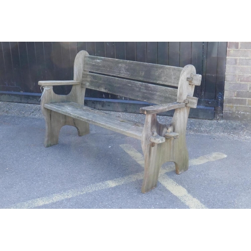 1084 - A weathered wood garden bench, 130cm wide